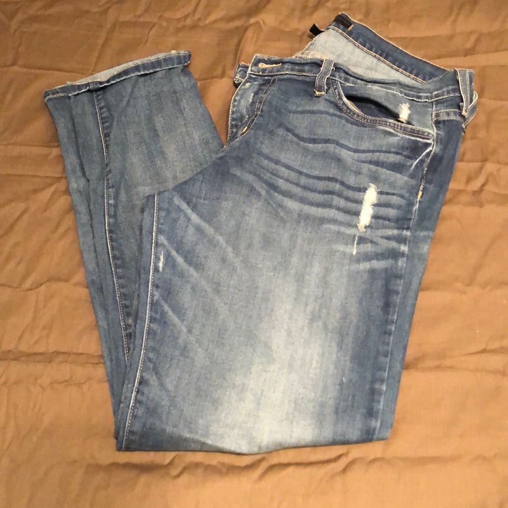 Women’s distressed flying monkey jeans
